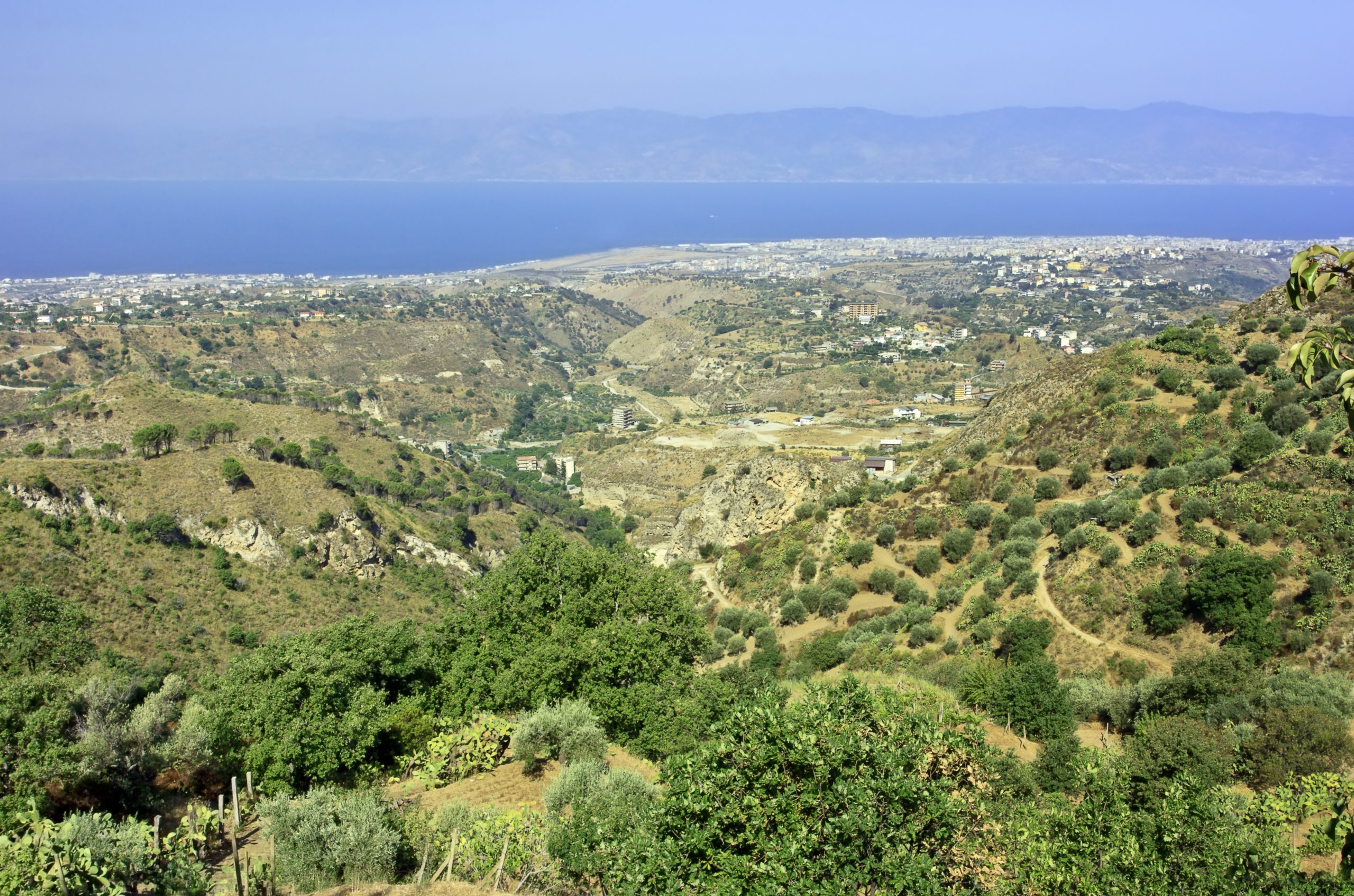 View on Reggio Calabria airport from Aspromonte with Olive Groves Sicily on background